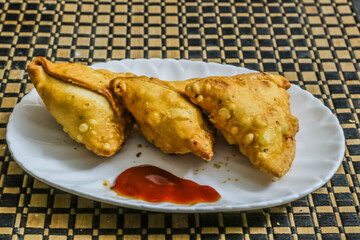 hot samosa getting ready to be served in a plate for evening snacks