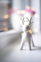 Christmas reindeer white decoration with bokeh lights