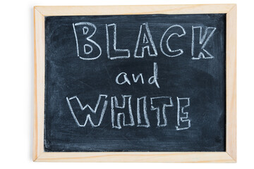 Black and White - written on chalkboard. Concept message