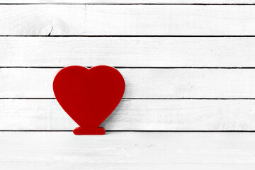 Red Heart Shaped over white wood background