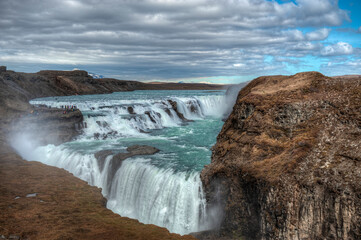 Gullfoss, Emblematic stepped waterfall located at a pronounced elbow of the Hvita River. Iceland..