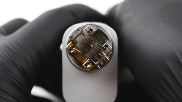 Vaping atomizer with clapton coil is working. Vape device or cigarette.