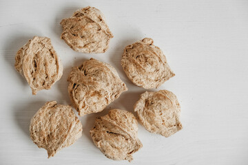 Raw dehydrated soy meat or soya chunks on a white wooden background. Top view. Copy, empty space for text