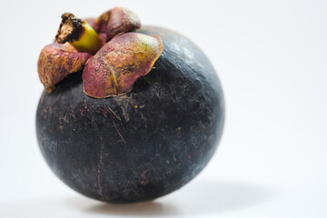 mangosteen fruits placed on a white background