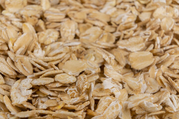 Oatmeal groats close-up in a jar on the background