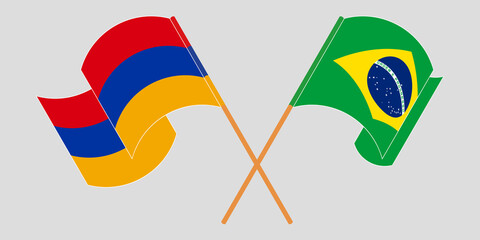 Crossed and waving flags of Armenia and Brazil