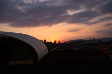open book with sunset