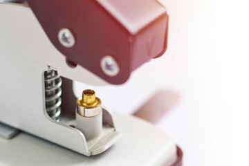 Tool or manual machine for installing the eyelet. Hole puncher and grommet installer with copy...