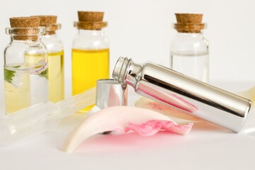 Beautiful photo of small bottles with cork stoppers filled with fantastic fragrant oils, essential...