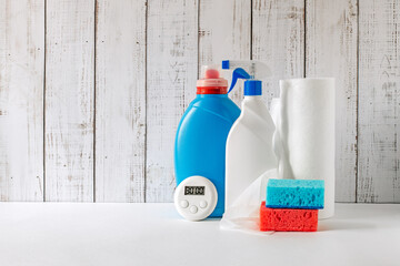 rags, sponges and cleaning products, 30-minute timer, the concept of quick cleaning and tidying up,...