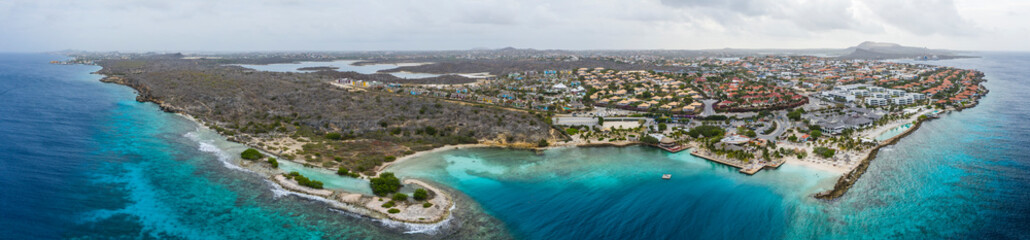 Fototapeta na wymiar Aerial view of coast of Curacao in the Caribbean Sea with turquoise water, cliff, beach and beautiful coral reef