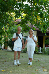 Portrait of elderly couple of tourists. Travel