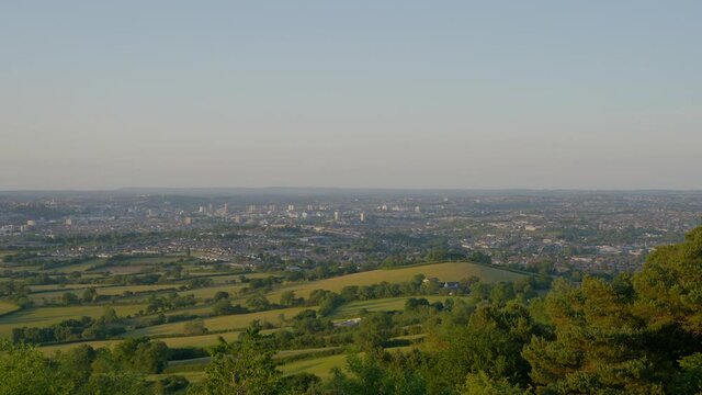 View of distant town in green England countryside