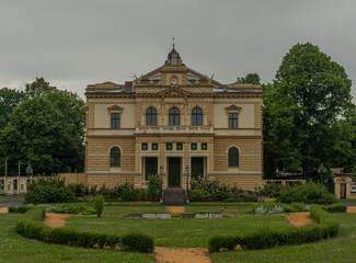 Old historic building in rainy park in Plzen city in west Bohemia