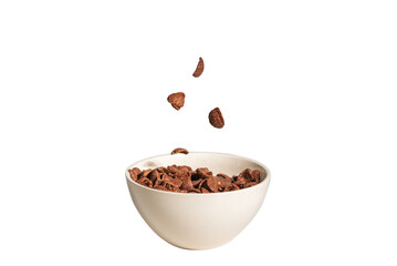 Chocolate corn flakes falling to the white bowl isolated on white. Motion.