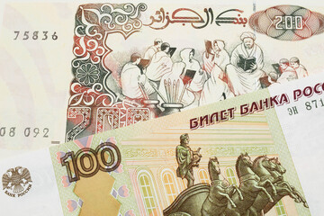 A macro image of a Russian one hundred ruble note paired up with a beige 200 Algerian dinar bank note.  Shot close up in macro.