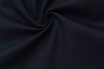 Close up of blue woolen fabric. Dark woolen blue fabric, background, wool