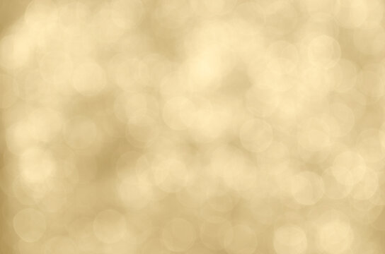 Champagne colored bokeh background.