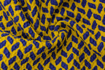 texture background pattern, fabric with a pattern of blue squares on a yellow background. This is a heavy square polyester pattern that fits perfectly with modern, transitional or contemporary