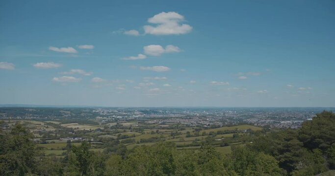 View of distant town in green England countryside