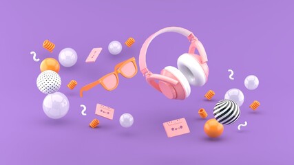 Headphones and glasses float between the balls on the purple backdrop.