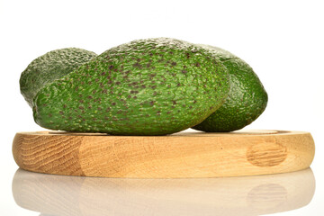 Green fresh ripe tasty avocado, close-up, on a white background.