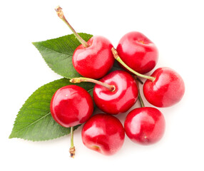 Group of sweet cherries with green leaves on a white background, isolated. The view from top