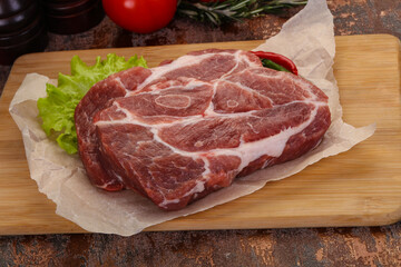 Raw pork neck steak