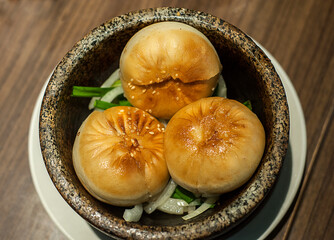 Kuala Lumpur, Malaysia - January 21, 2020 :3 pieces of Oriental BBQ pork/chicken buns serve on bow.