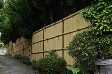 A Japanese style hedge made of artificial bamboo.