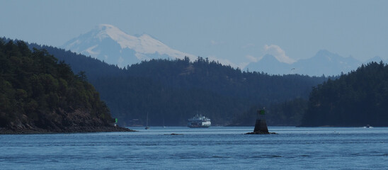 Washington State Ferry transiting between San Juan Islands with Mt Baker in background