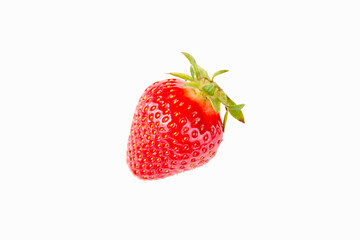 Ripe strawberries in the center of a white plate, on a white background
