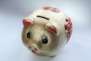 Kuala Lumpur, Malaysia - May 11, 2020 : Golden color Piggy Bank with red chinese character...