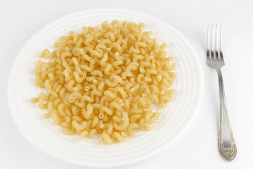 Prefabricated pasta on a plate with a fork white background