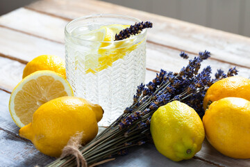 Concept of summer refreshing healthy alcohol free homemade lemonade with lemons and lavender. Low...