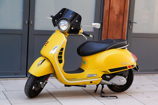 Vespa yellow motorbike Italian brand of scooter manufactured by Piaggio