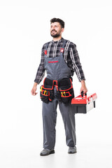 Full length portrait of a handyman with box isolated over white wall background.