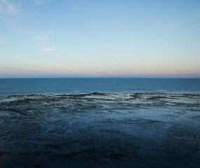Seascape. Panorama view of the ocean water at sunset. 