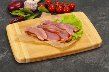 Sliced smoked duck breast served salad