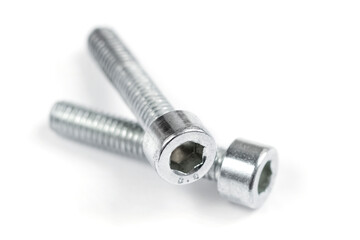 Two screw nuts on a white background. Stainless screws, bolts for construction