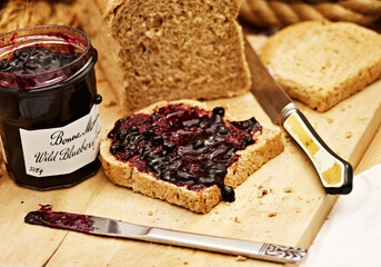 Delicious Toast with Jam on top of a wooden table