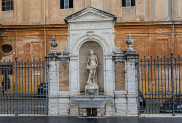 ROME, ITALY - DECEMBER 05, 2019:  Fountain in the inner courtyard of the Vatican Museum in Rome, Italy