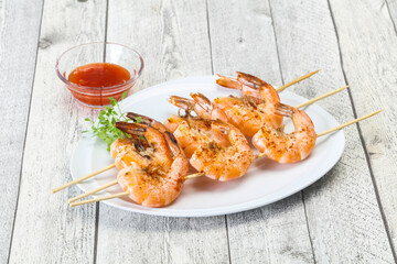 Grilled prawn skewer with sauce