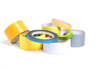 A heap of packing tape and a masking tape isolated on white background, with clipping path. adhesive tape. Scotch tape.


