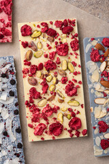 Craft white chocolate with freeze-dried raspberries and pistachios.