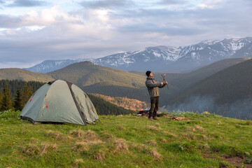 hiker with equipment spends time hiking in the mountains