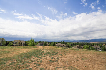 Fototapeta na wymiar landscape over a neighborhood, Rocky Mountains in the background