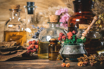 Magic potions on the witch doctor table close up background.