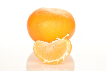Bright yellow juicy, fresh, organic tangerines, close-up, on a white background.