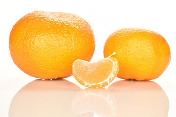 Bright yellow juicy, fresh, organic tangerines, close-up, on a white background.